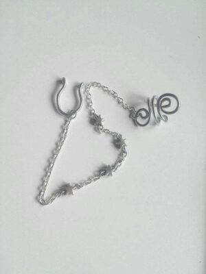 Handmade Star Septum Nose to Ear Chain with silver metallic star beads - Body Jewelry - No piercing nose required (fake nose ring)- Ring Adaptable, Fake septum, you can wear it without a nose piercing - The chain is approximately 13cm long and is only 3mm wide, which is so tiny - Hoop Nose Made from 16 gauge aluminium wire non-tarnish and antiallergenic - Each piece is created by hand, giving it a unique charm. ***************************************************************************************** Each piece is handcrafted using thick, anodized aluminium wire. Important Note: To keep the ring in perfect condition is important to know how to open and close our ring properly; look for the opening of the ring and place the fingers of each hand on each side of the opening and make a sideways movement with each hand in a reverse direction